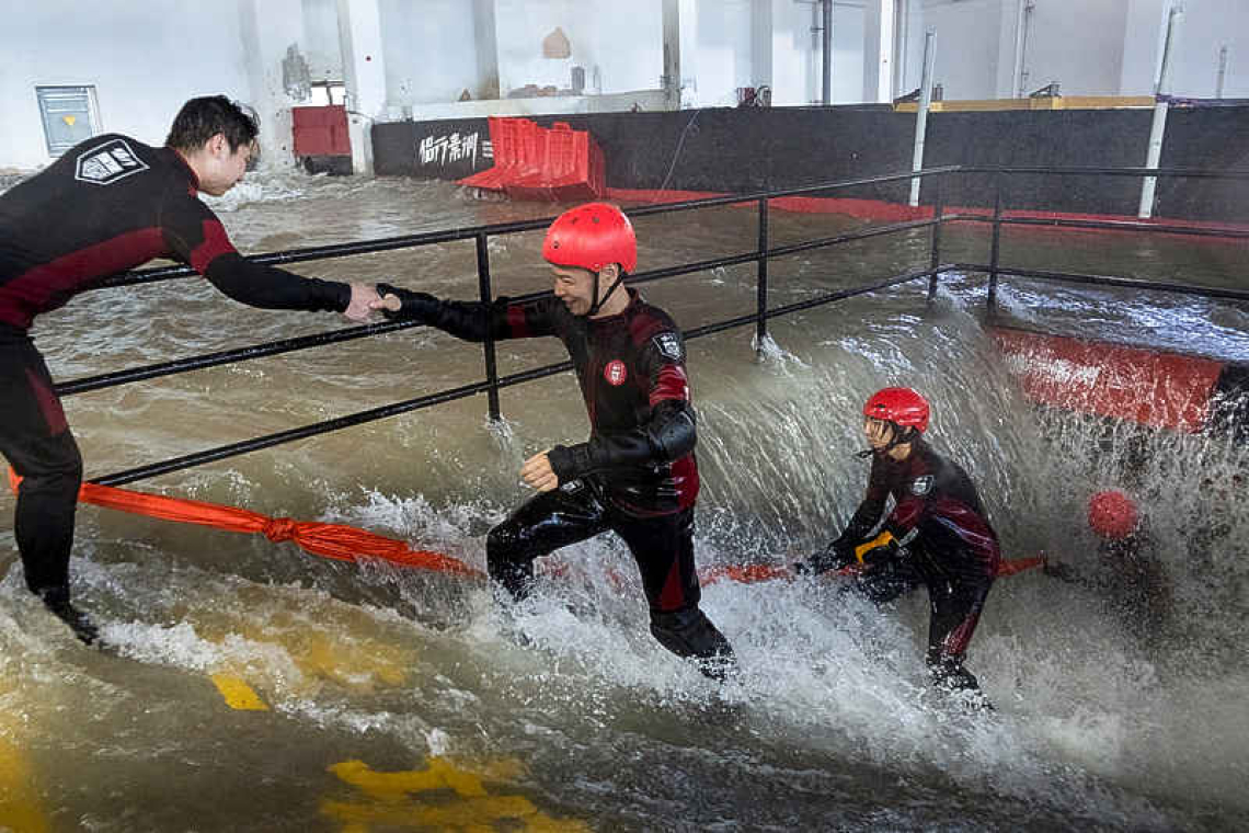 In China, people brave simulated  typhoons to prepare for real thing